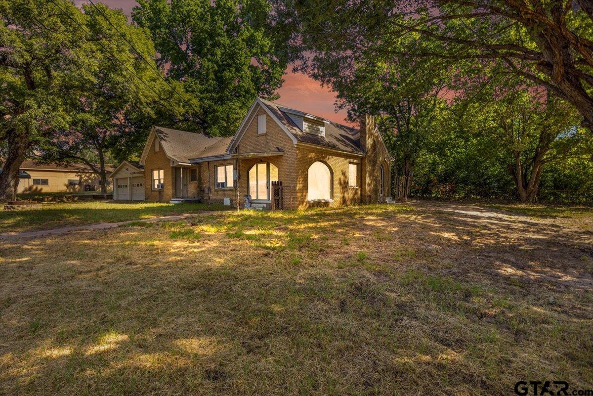 6521 Highway 271 Tyler, TX 75708 - Photo 1 of 35 a front view of a house with a yard