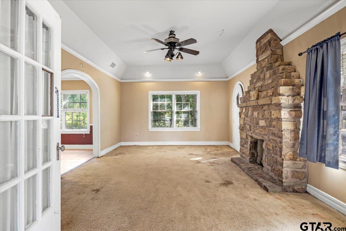 6521 Highway 271 Tyler, TX 75708 - Photo 16 of 35 a view of an empty room with a fireplace and a window