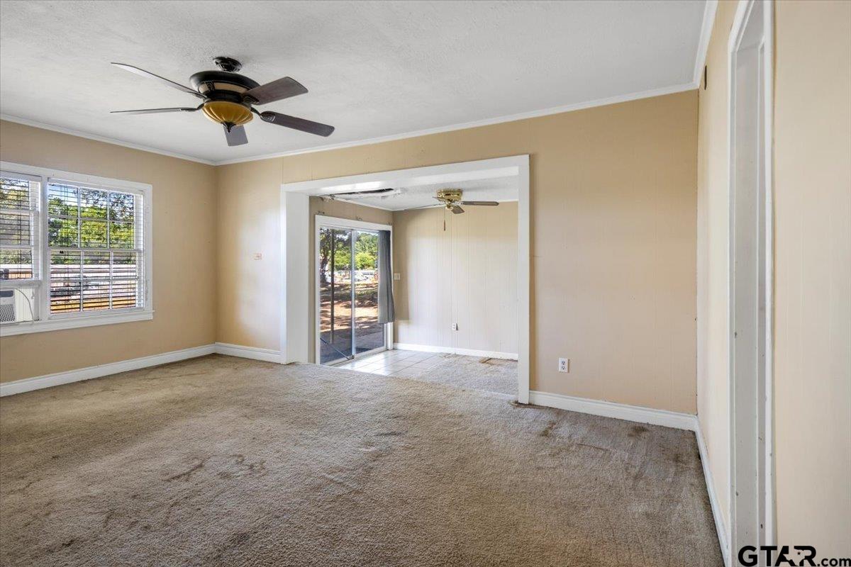 6521 Highway 271 Tyler, TX 75708 - Photo 20 of 35 a view of a livingroom with a ceiling fan and window