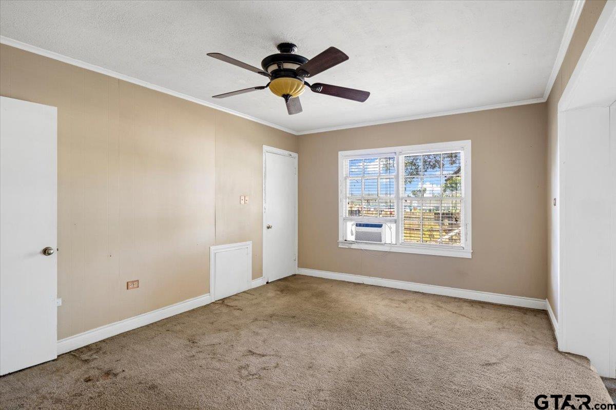 6521 Highway 271 Tyler, TX 75708 - Photo 21 of 35 a view of a livingroom with a ceiling fan and window