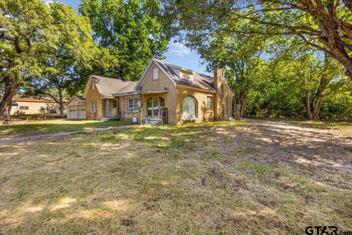6521 Highway 271 Tyler, TX 75708 - Photo 27 of 35 a front view of a house with a yard