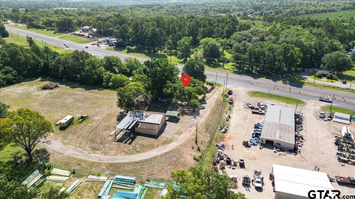 6521 Highway 271 Tyler, TX 75708 - Photo 34 of 35 an aerial view of a house with outdoor space swimming pool and mountains