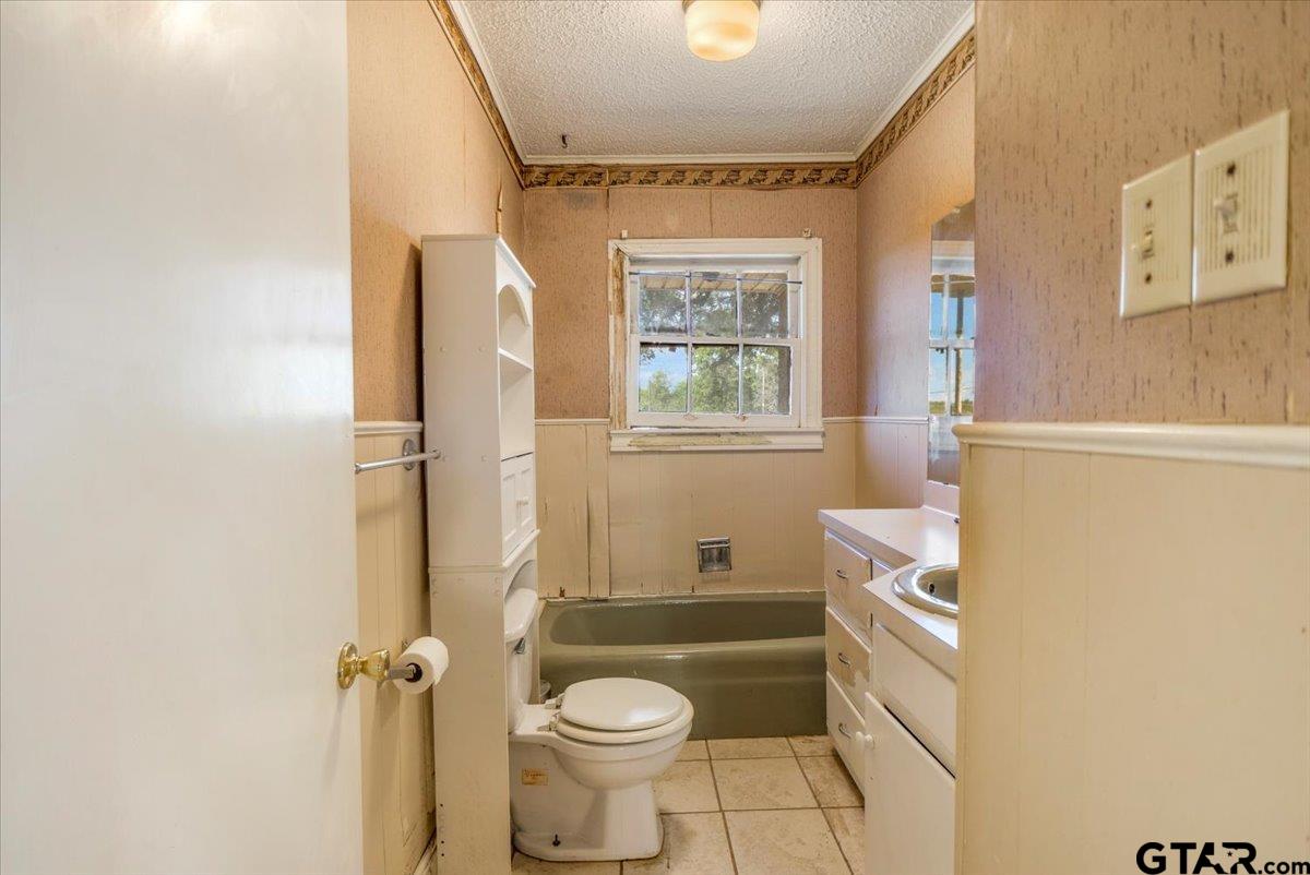 6521 Highway 271 Tyler, TX 75708 - Photo 9 of 35 a bathroom with a sink toilet and shower