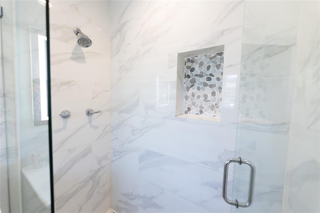 1497 Southwest Buckskin Trail Stuart, FL 34997 - Photo 18 of 48 a bathroom with a shower