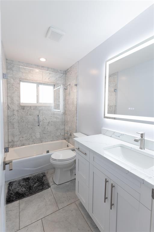 1497 Southwest Buckskin Trail Stuart, FL 34997 - Photo 24 of 48 a bathroom with a sink a toilet and bathtub