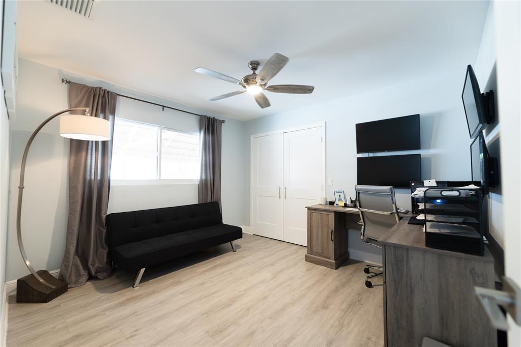 1497 Southwest Buckskin Trail Stuart, FL 34997 - Photo 26 of 48 a living room with furniture and a flat screen tv