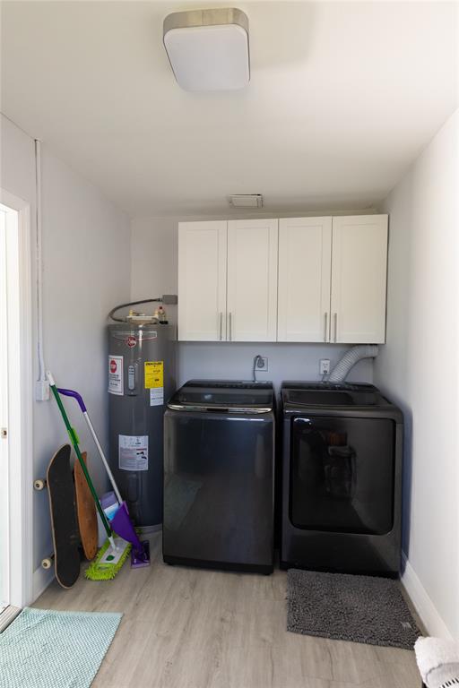 1497 Southwest Buckskin Trail Stuart, FL 34997 - Photo 30 of 48 a kitchen with stainless steel appliances granite countertop a stove and a wooden floors