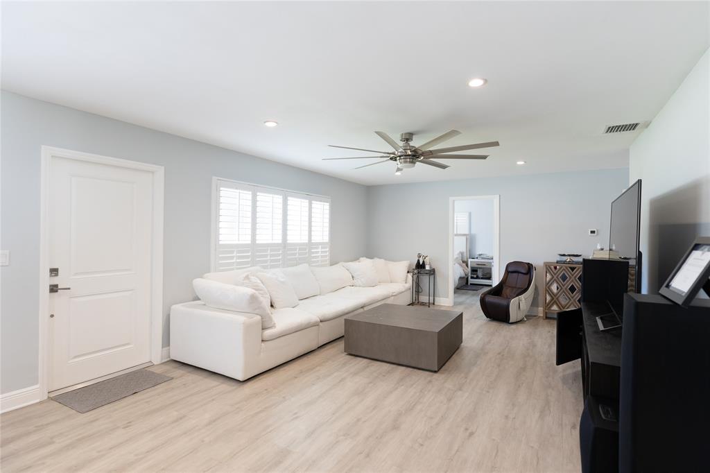 1497 Southwest Buckskin Trail Stuart, FL 34997 - Photo 3 of 48 a living room with furniture and a flat screen tv