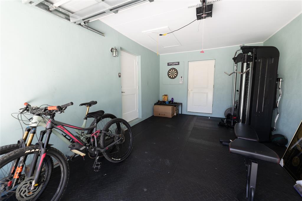 1497 Southwest Buckskin Trail Stuart, FL 34997 - Photo 32 of 48 a view of a room with gym equipment