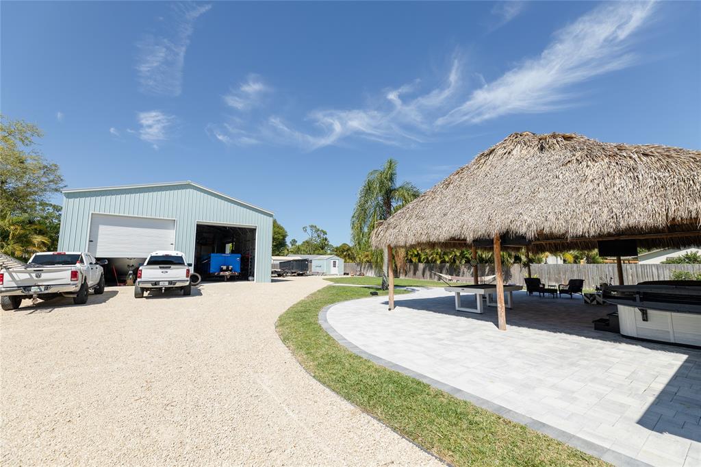 1497 Southwest Buckskin Trail Stuart, FL 34997 - Photo 40 of 48 a view of a porch and patio