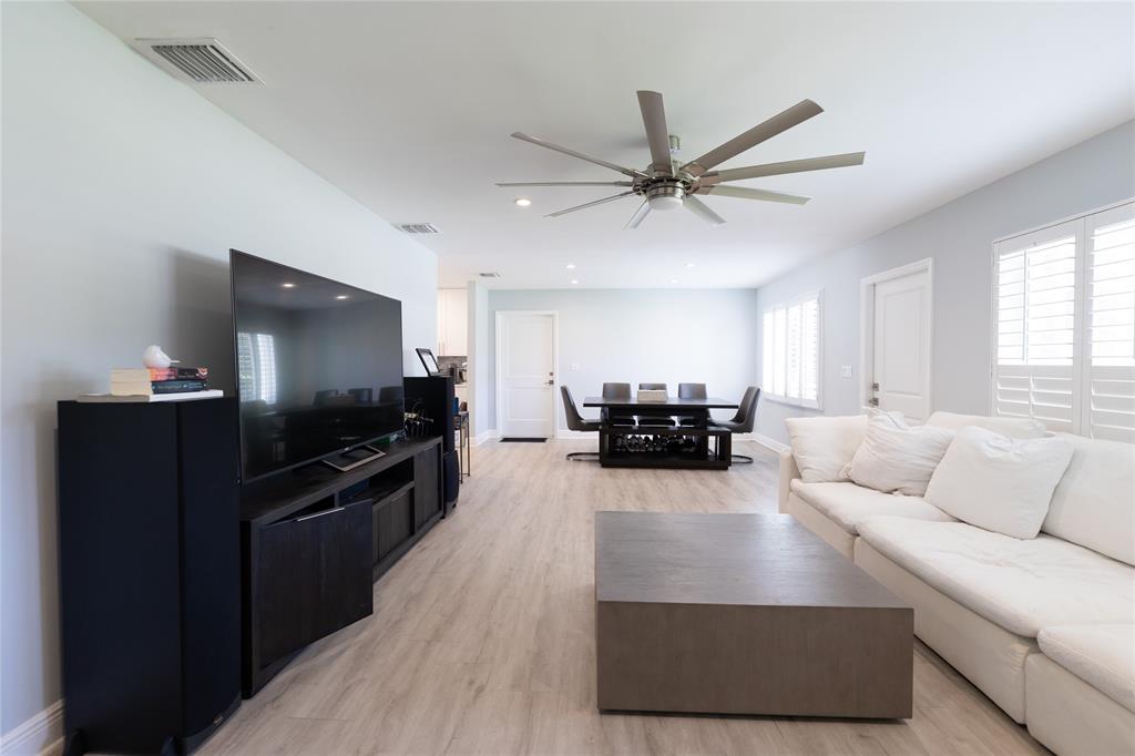 1497 Southwest Buckskin Trail Stuart, FL 34997 - Photo 4 of 48 a living room with furniture and a flat screen tv