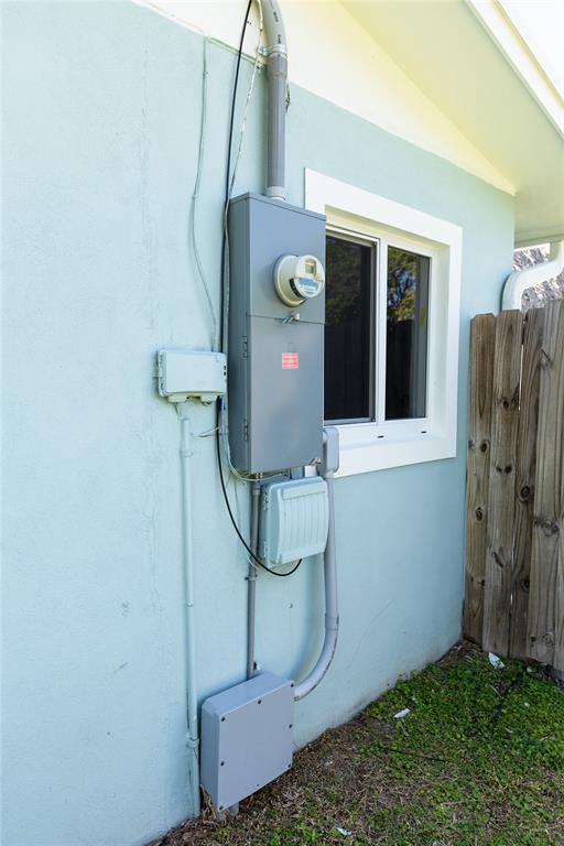 1497 Southwest Buckskin Trail Stuart, FL 34997 - Photo 43 of 48 a room with water heater and storage racks