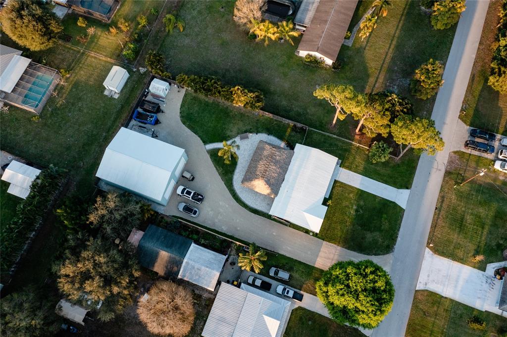 1497 Southwest Buckskin Trail Stuart, FL 34997 - Photo 47 of 48 an aerial view of a house having outdoor space