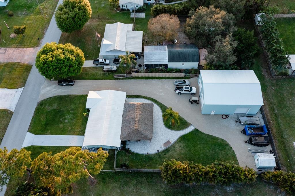 1497 Southwest Buckskin Trail Stuart, FL 34997 - Photo 48 of 48 an aerial view of a house having yard