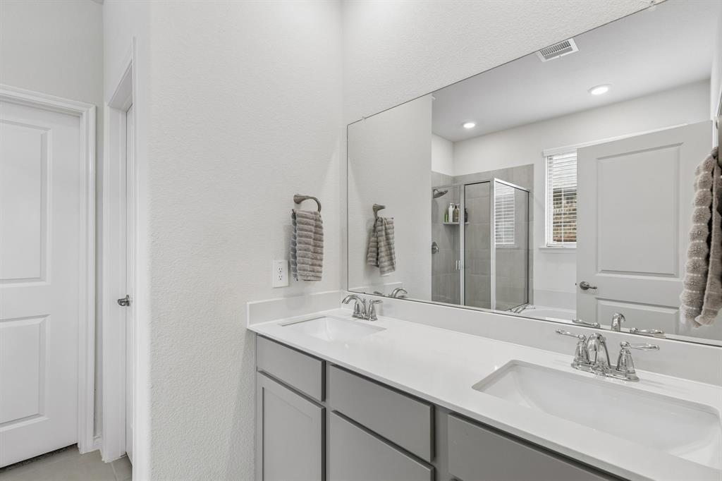 10313 Geode Street Aubrey, TX 76227 - Photo 5 of 13 Double vanity with undermount sinks and brushed nickel fixtures