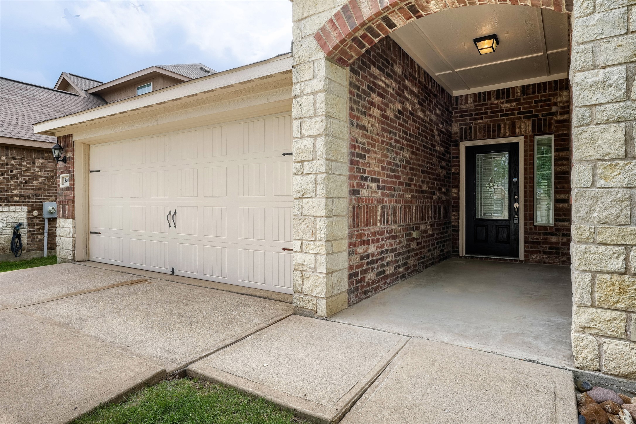 13408 Clara Martin Road Manor, TX 78653 - Photo 2 of 27 a view of a brick house with a large door