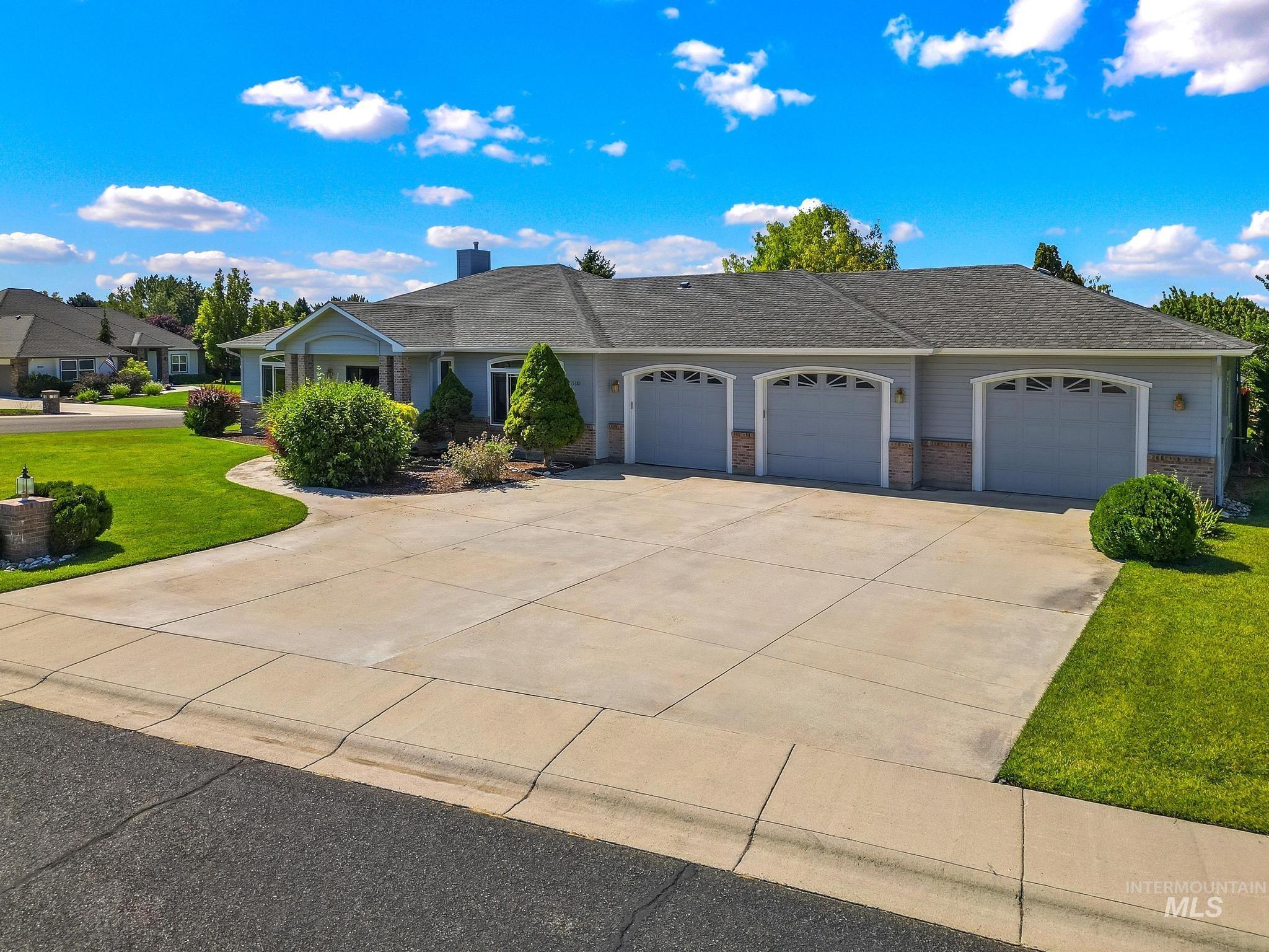 15181 Drury Way Caldwell, ID 83607 - Photo 37 of 49 Spacious single-story residence with a three-car garage and extensive concrete driveway