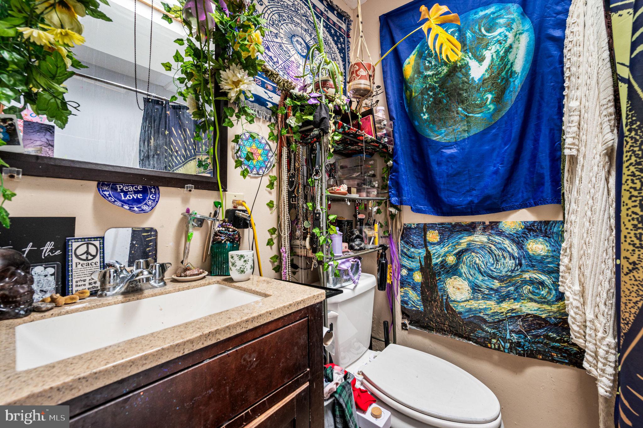 828 Derwyn Road Drexel Hill, PA 19026 - Photo 16 of 25 a bathroom with a toilet sink and mirror