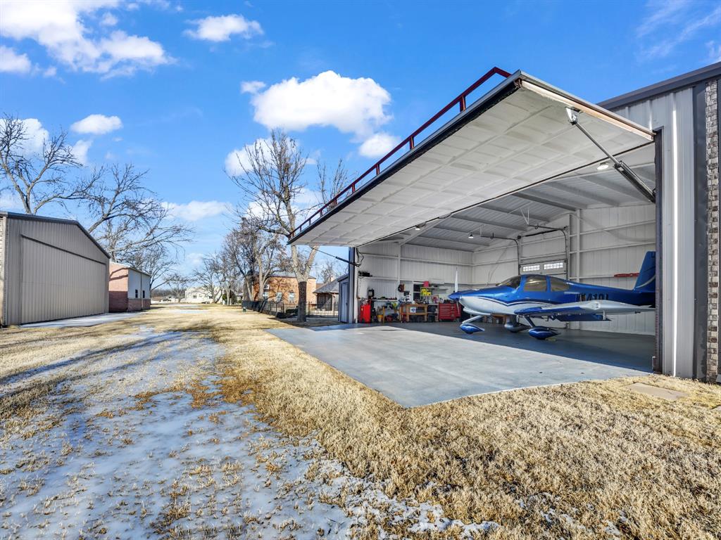 5418 Wedgefield Road Granbury, TX 76049 - Photo 34 of 40 30x42 hangar with door 11.5’x38’