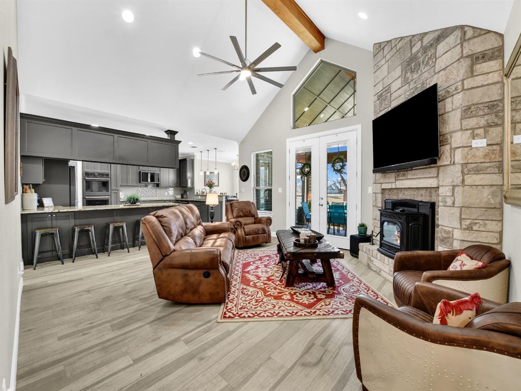5418 Wedgefield Road Granbury, TX 76049 - Photo 9 of 40 Living room with beam and fireplace