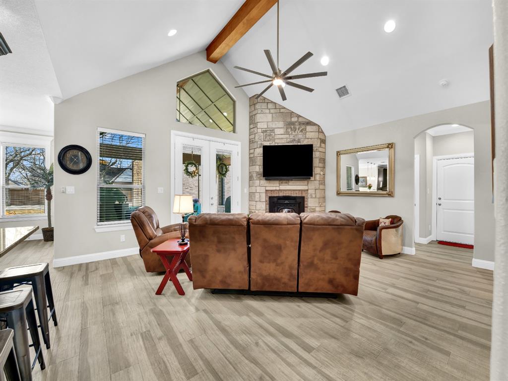 5418 Wedgefield Road Granbury, TX 76049 - Photo 10 of 40 Bar seating, living room, fireplace