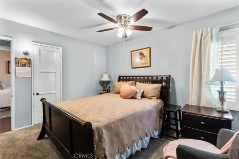 a bedroom with bed and window