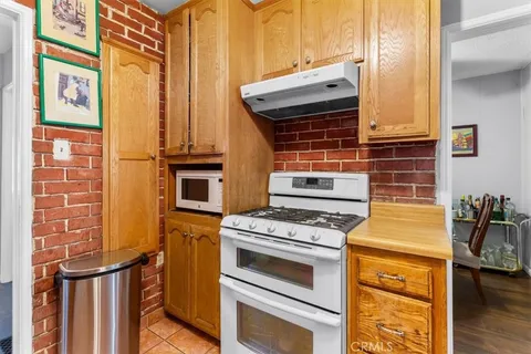 a kitchen with a stove and a microwave
