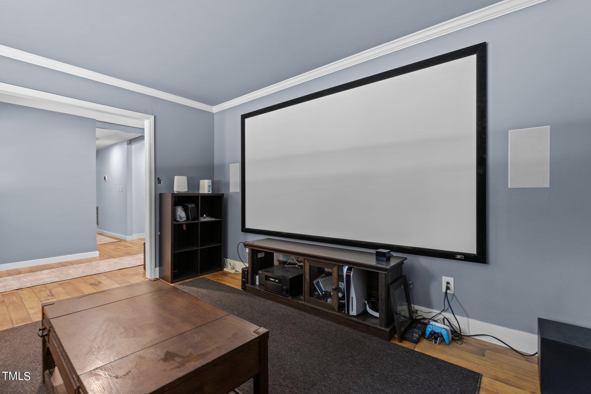 8809 Leesville Road Raleigh, NC 27613 - Photo 18 of 32 a living room with furniture and a flat screen tv