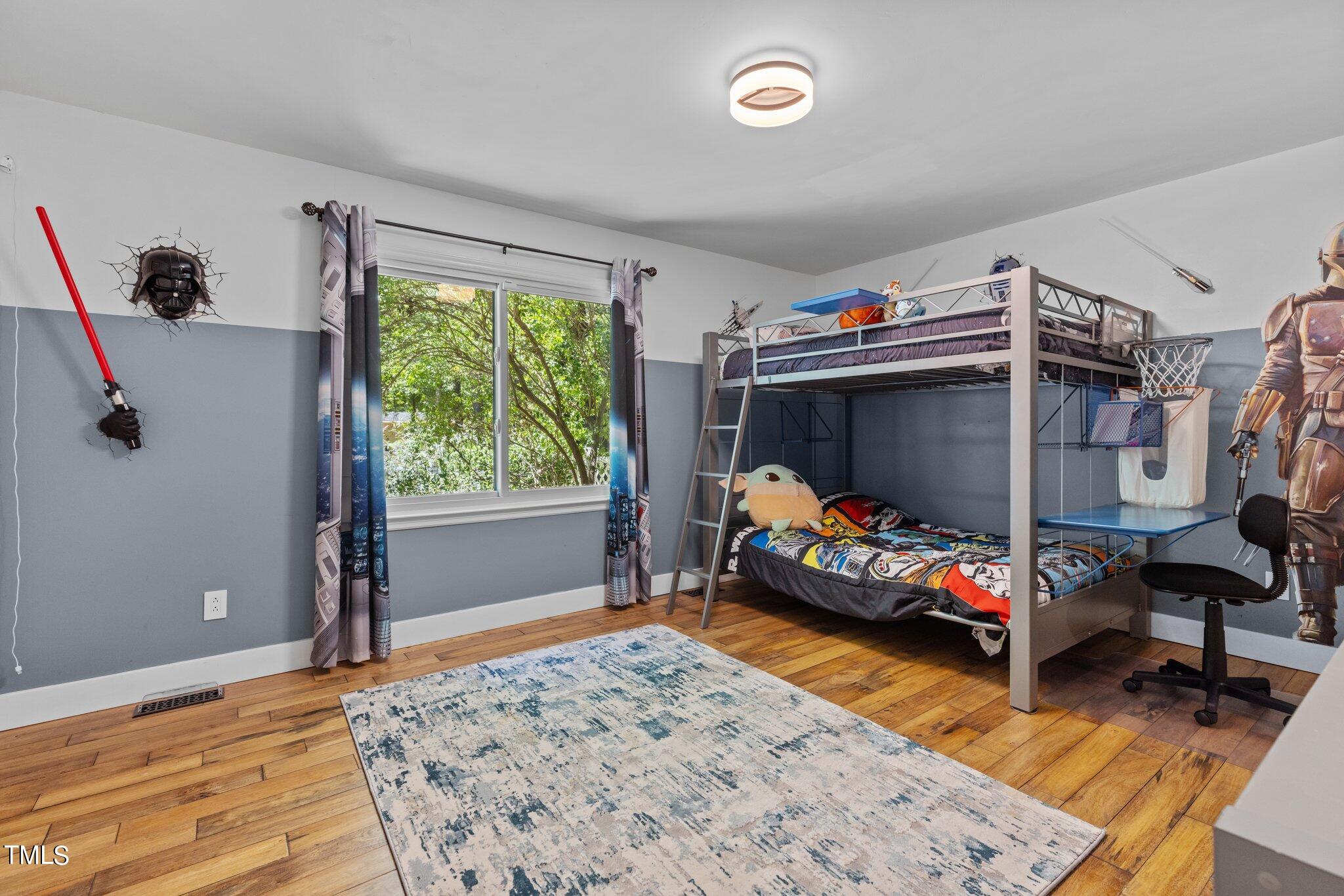 8809 Leesville Road Raleigh, NC 27613 - Photo 26 of 32 a bedroom with a bed and a window