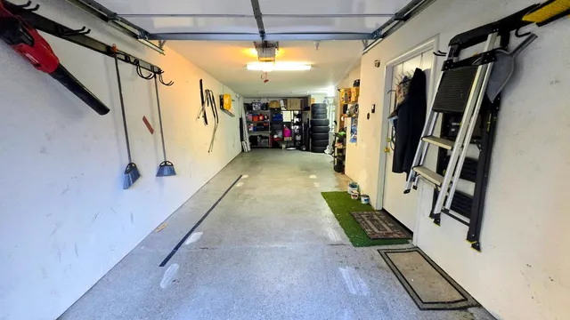 a view of water heater room with stairs