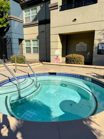 a view of a backyard with swimming pool
