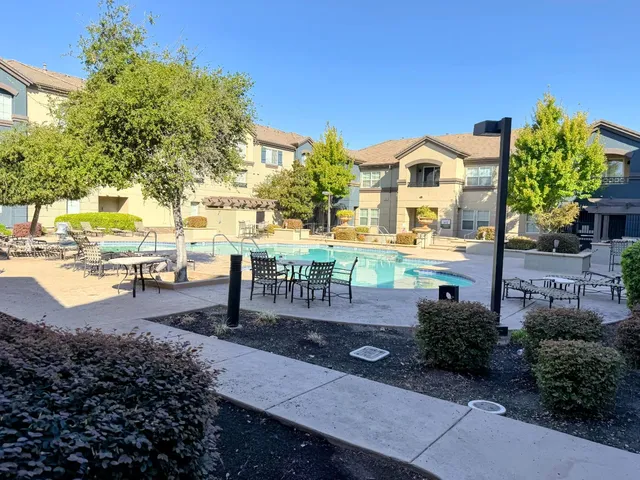 a view of a swimming pool with a patio