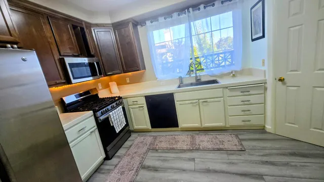 a bathroom with a sink a mirror and a shower