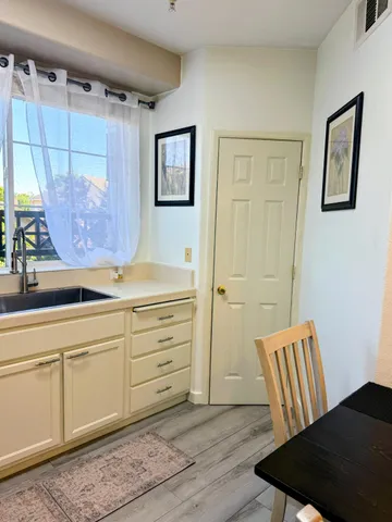 a view of room with window and cabinet