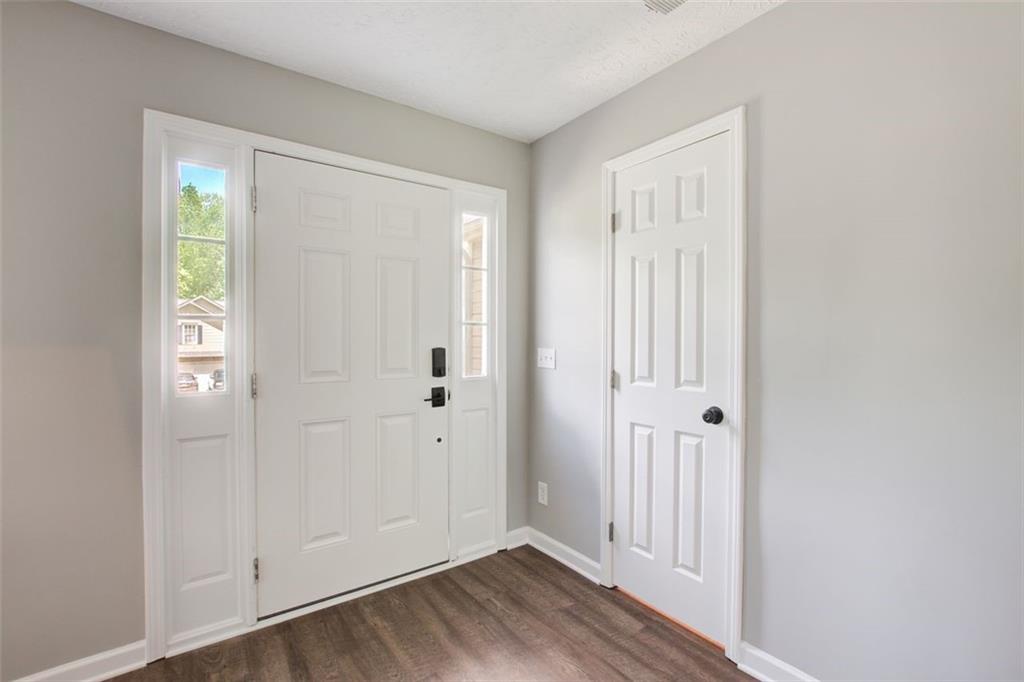 4110 Ridgebrook Bend Cumming, GA 30028 - Photo 2 of 49 an empty room with wooden floor