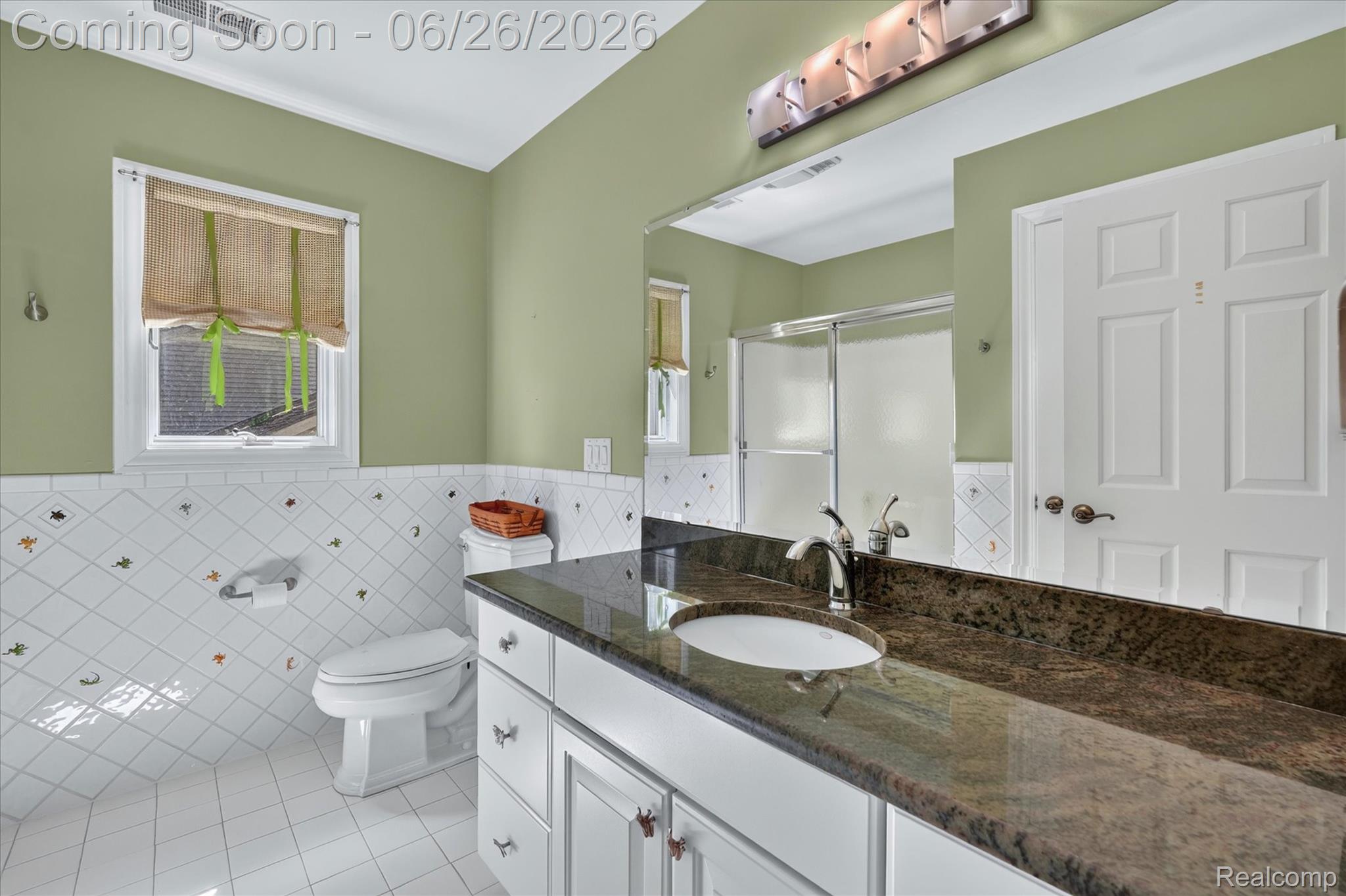 3478 Lexington Road Waterford, MI 48328 - Photo 28 of 52 Spacious bathroom featuring a double vanity with an integrated sink, polished stone countertop, and chrome fixtures
