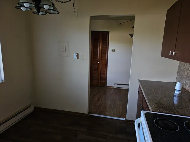 a view of an entryway with wooden floor