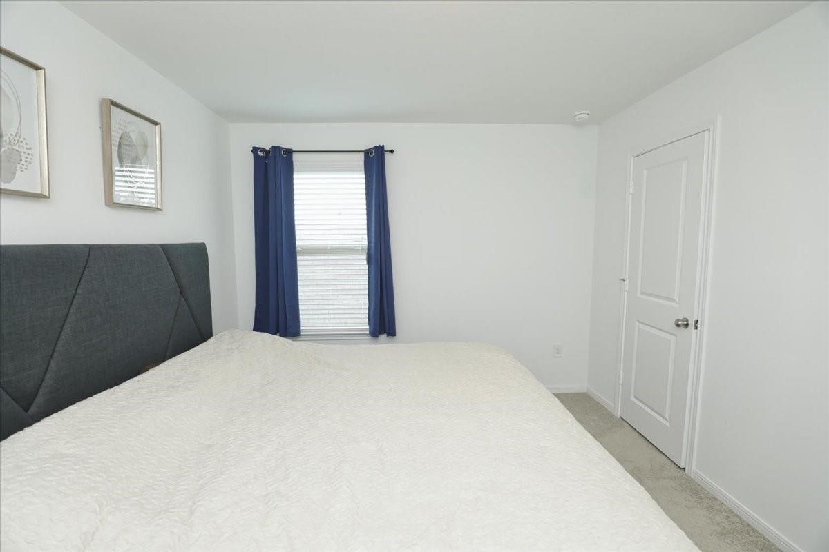 14463 Cedar Br Lane Conroe, TX 77302 - Photo 25 of 50 a large white bed in a white room