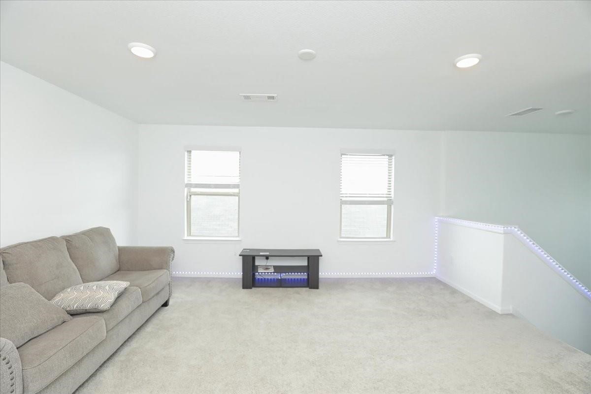 14463 Cedar Br Lane Conroe, TX 77302 - Photo 29 of 50 a living room with furniture and a window
