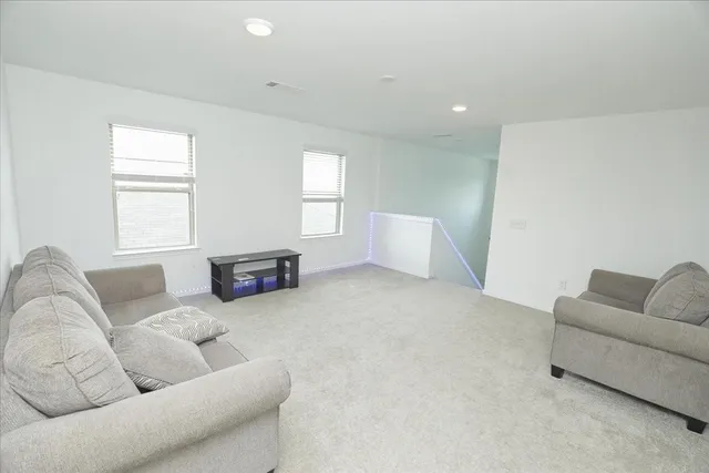 a living room with furniture and a couch