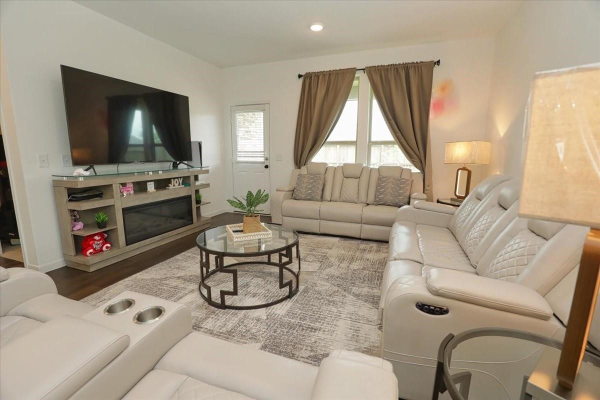 14463 Cedar Br Lane Conroe, TX 77302 - Photo 3 of 50 a living room with furniture and a flat screen tv