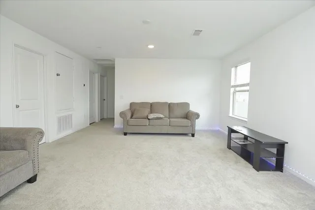 a living room with furniture and a couch