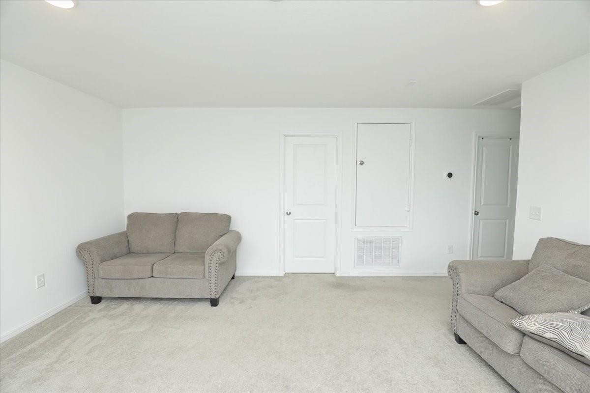 14463 Cedar Br Lane Conroe, TX 77302 - Photo 33 of 50 a living room with furniture and white walls