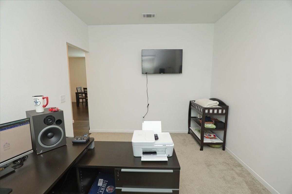 14463 Cedar Br Lane Conroe, TX 77302 - Photo 42 of 50 a room with a flat screen tv and a couch