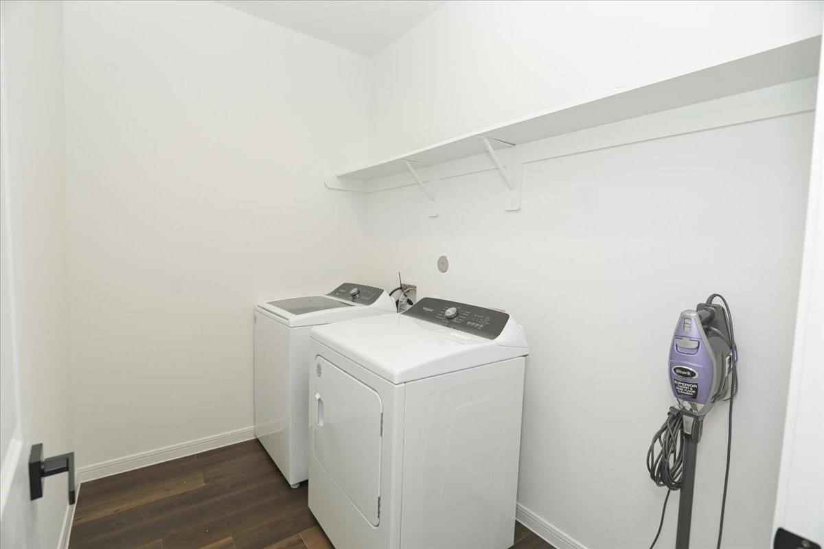 14463 Cedar Br Lane Conroe, TX 77302 - Photo 47 of 50 a utility room with dryer and washer