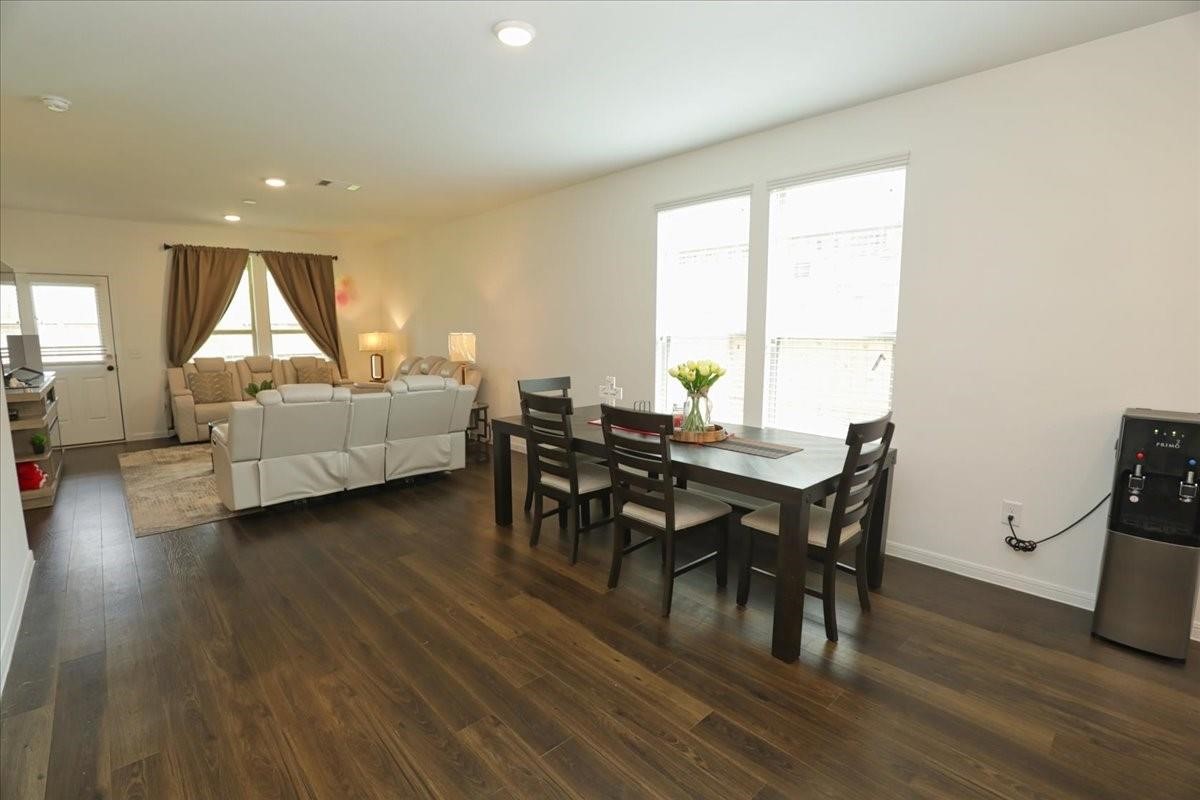 14463 Cedar Br Lane Conroe, TX 77302 - Photo 8 of 50 a view of a dining room with furniture and wooden floor