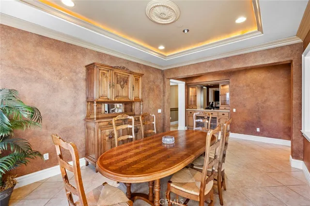 a spacious bedroom with a bed and large window