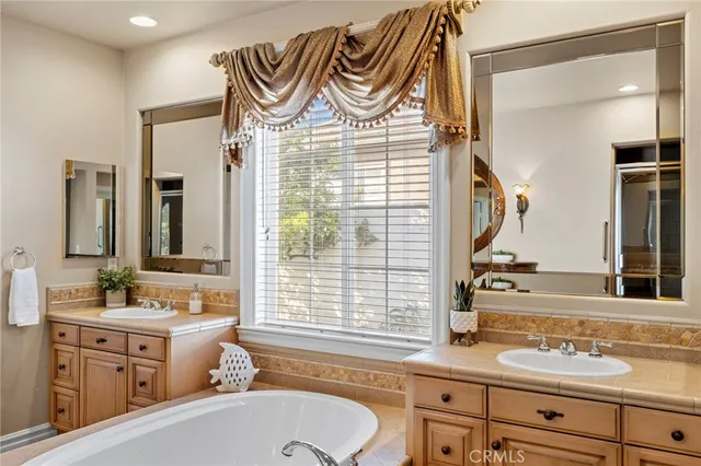 a living room with furniture fireplace and a large window