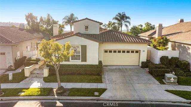 a living room with furniture a rug and a chandelier