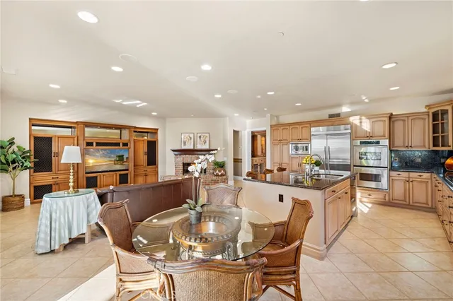 a large kitchen with a table and chairs